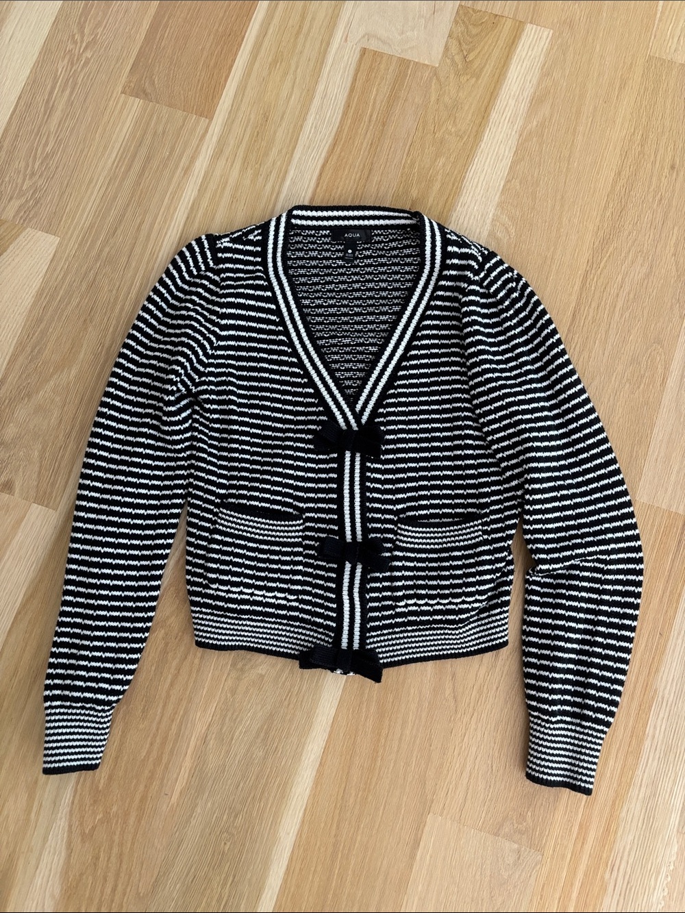 Aqua Women’s Black and White Striped V-Neck Bow Cardigan